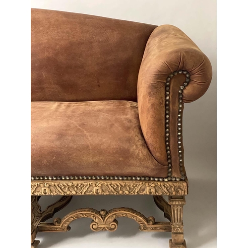 233 - SOFA, early 20th century, natural hide leather, brass studded, with arched back scroll arms and carv... 