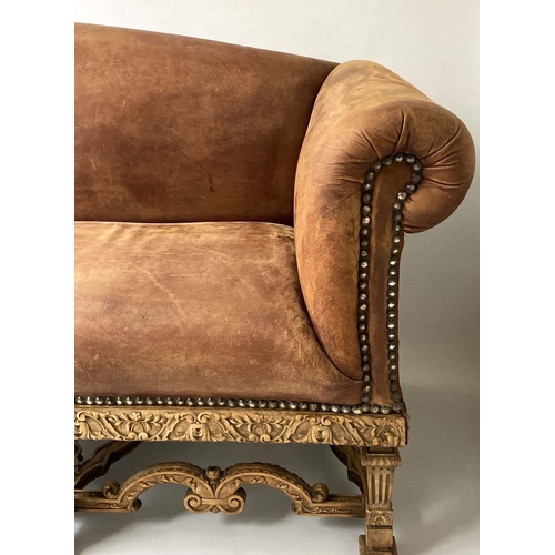 233 - SOFA, early 20th century, natural hide leather, brass studded, with arched back scroll arms and carv... 