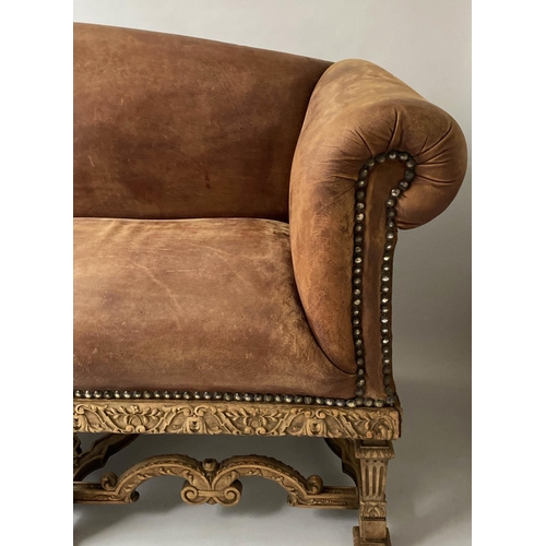 233 - SOFA, early 20th century, natural hide leather, brass studded, with arched back scroll arms and carv... 