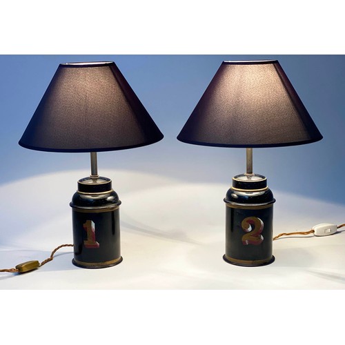 224 - TOLEWARE TABLE LAMPS, a pair, early 20th century gilt lettered toleware tea canisters converted to l... 