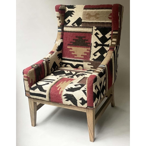 225 - KELIM WING ARMCHAIR, with square section stretchered supports, 70cm W.