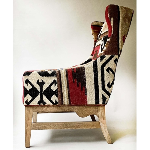 225 - KELIM WING ARMCHAIR, with square section stretchered supports, 70cm W.