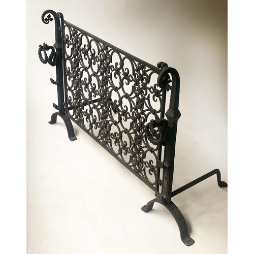 220 - FIREDOGS/FENDER, wrought iron with two fire dog ends and suspended grillwork fender, 141cm x 79cm H.