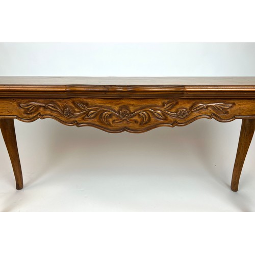 297 - CONSOLE TABLE, French provincial style fruit wood, the shaped top above a carved frieze on cabriole ... 