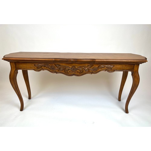 297 - CONSOLE TABLE, French provincial style fruit wood, the shaped top above a carved frieze on cabriole ... 