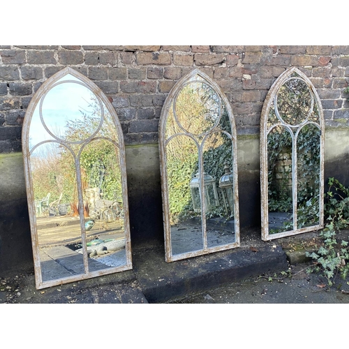 480 - ARCHITECTURAL GARDEN MIRRORS, a set of three, 122cm x 56cm, aged metal frames. (3)