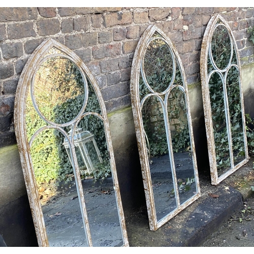 480 - ARCHITECTURAL GARDEN MIRRORS, a set of three, 122cm x 56cm, aged metal frames. (3)