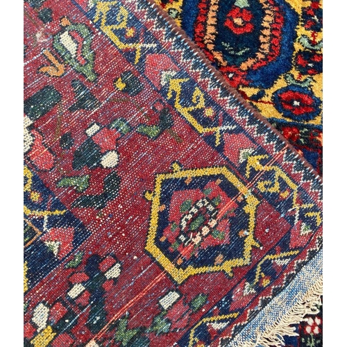 13 - ANTIQUE PERSIAN BAKHTIARI CARPET, 350cm x 220cm.