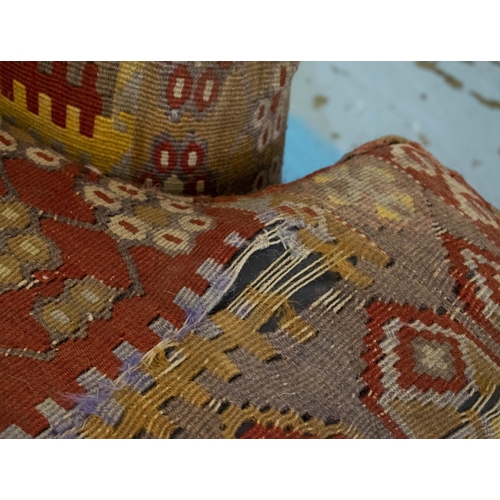 256 - KILIM SOFA, 186cm x 94cm, three seater with turned feet and brass castors.