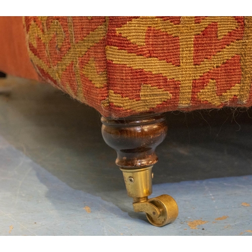 256 - KILIM SOFA, 186cm x 94cm, three seater with turned feet and brass castors.