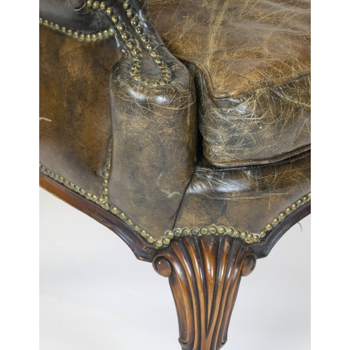 275 - WING ARMCHAIR, 111cm H x 84cm, Georgian style in brown leather.