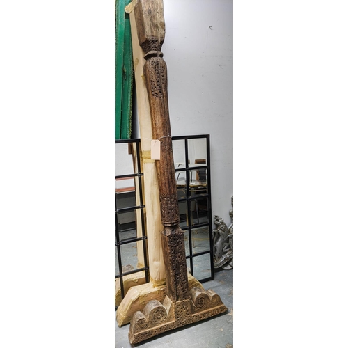 421 - ARCHITECTURAL BALINESE CARVED COLUMNS, a pair, 223cm H.