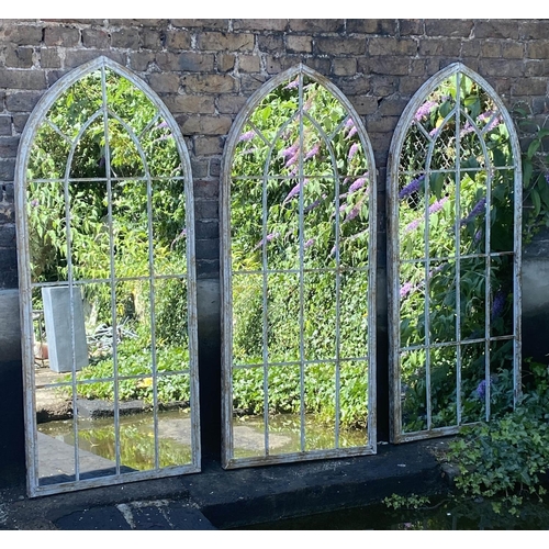 574 - ARCHITECTURAL GARDEN MIRRORS, three, distressed metal frames, 159cm x 67cm. (3)