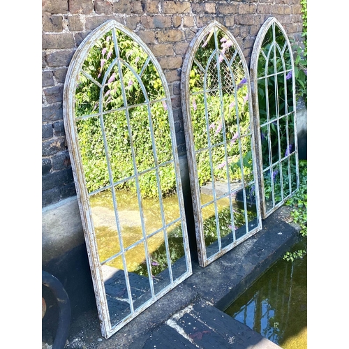 574 - ARCHITECTURAL GARDEN MIRRORS, three, distressed metal frames, 159cm x 67cm. (3)