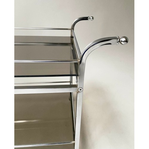 364 - DRINKS TROLLEY, 1970's chromed with two smoked glass tiers, handles and castors, 87cm x 48cm x 65cm ... 