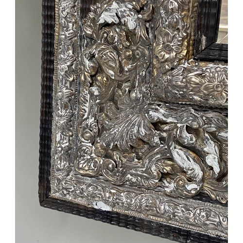 193 - WALL MIRROR, 111cm H x 95cm W, 19th century Dutch, cushion form, repoussé silvered metal, with bevel... 