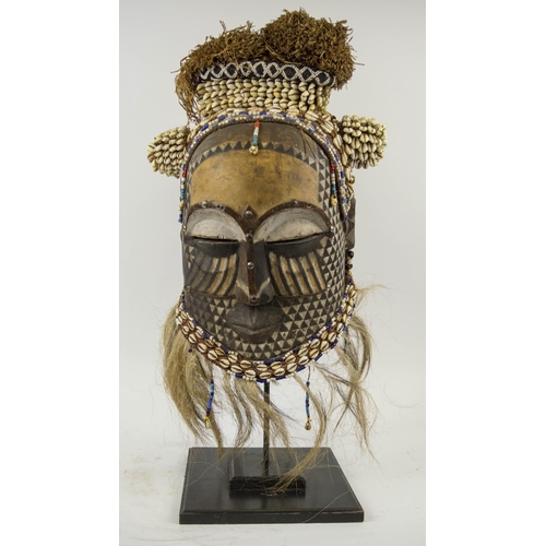 115 - KUBA MASK, Congolese, carved wood, painted and adorned with Cowrie shells and beads 65cm H