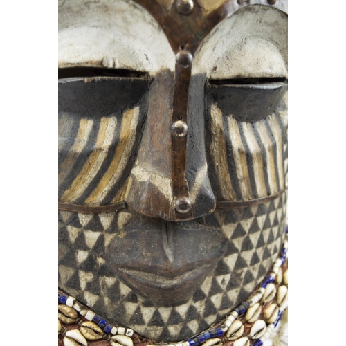 115 - KUBA MASK, Congolese, carved wood, painted and adorned with Cowrie shells and beads 65cm H