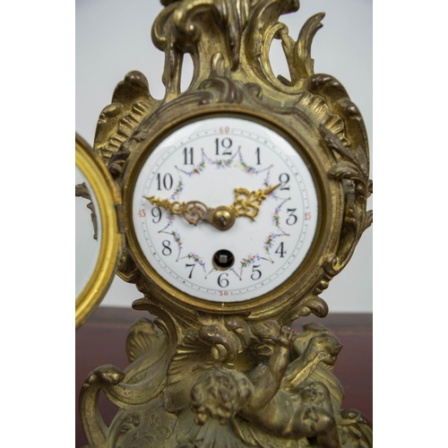 138 - MANTLE CLOCK, 19th century French Rococo, enameled face with scrolling putti adorned bronze case, 30... 