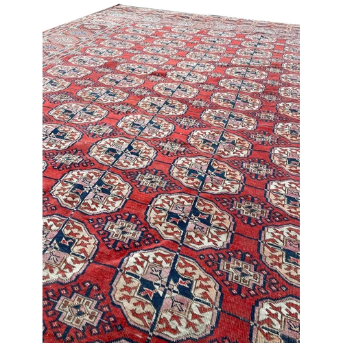 24 - ANTIQUE TURKMAN BOKHARA CARPET, 350cm x 235cm.