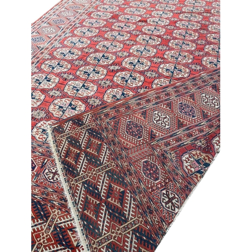 24 - ANTIQUE TURKMAN BOKHARA CARPET, 350cm x 235cm.