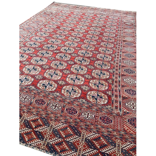 24 - ANTIQUE TURKMAN BOKHARA CARPET, 350cm x 235cm.