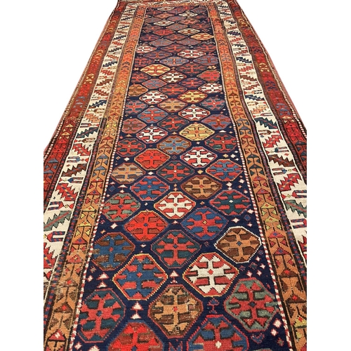 30 - ANTIQUE NORTH WEST PERSIAN RUNNER, 365cm x 105cm.