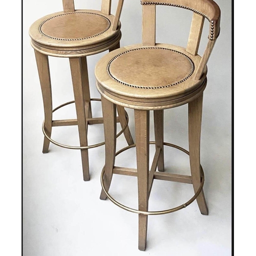 191 - BAR STOOLS, a pair, by Wychwood design Oxfordshire in studded  leather and solid oak, 102cm H seat h... 