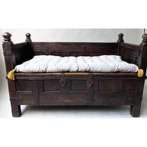 193 - INDIAN SETTLE, North Indian teak and iron bound with rising seat and cushion, 140cm x 75cm x 90cm H.