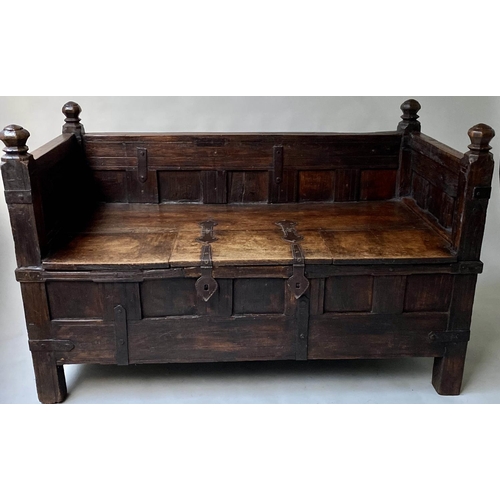 193 - INDIAN SETTLE, North Indian teak and iron bound with rising seat and cushion, 140cm x 75cm x 90cm H.