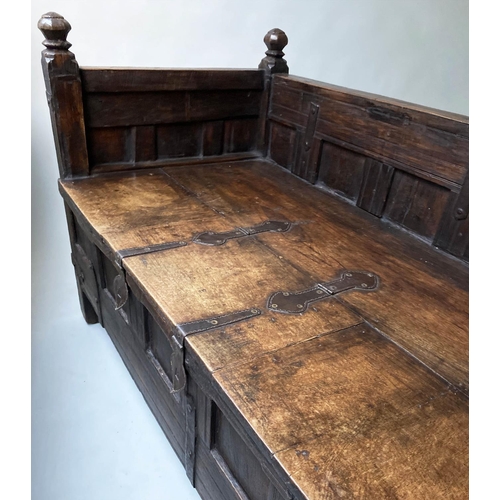 193 - INDIAN SETTLE, North Indian teak and iron bound with rising seat and cushion, 140cm x 75cm x 90cm H.