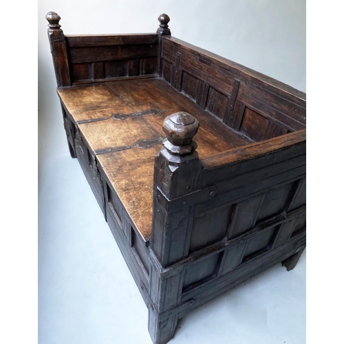 193 - INDIAN SETTLE, North Indian teak and iron bound with rising seat and cushion, 140cm x 75cm x 90cm H.