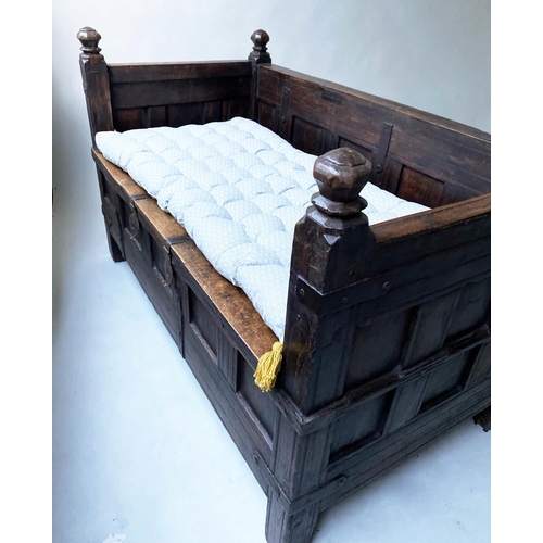 193 - INDIAN SETTLE, North Indian teak and iron bound with rising seat and cushion, 140cm x 75cm x 90cm H.