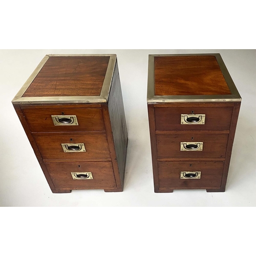 129 - CAMPAIGN BEDSIDE CHESTS, a pair mahogany each with three drawers, 31cm W x 51cm D x 56cm H. (2)