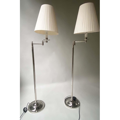 140 - STANDARD/READING LAMPS, a pair, chromium framed with twin hinged adjustable arms and shades, 150cm H... 