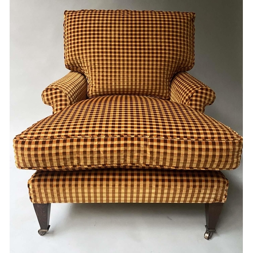 144 - ARMCHAIR AND FOOTSTOOL, Howard style check upholstered with matching footstool. (2)