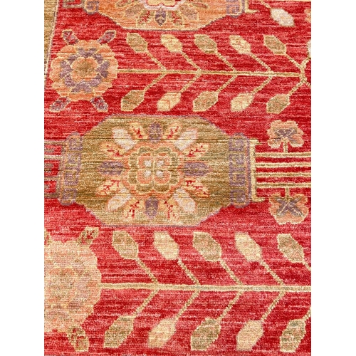 8 - FINE KHOTAN DESIGN RUG, 245cm x 160cm.