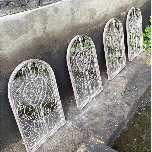 578 - ARCHITECTURAL GARDEN WALL MIRRORS, a set of four, gated design, 50cm x 32cm. (4)