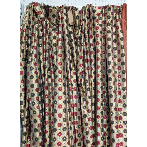 555 - CURTAINS, a pair, gold with red, cream and brown circle decoration contemporary design, silk, with i... 