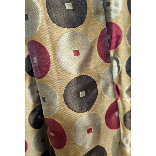 555 - CURTAINS, a pair, gold with red, cream and brown circle decoration contemporary design, silk, with i... 