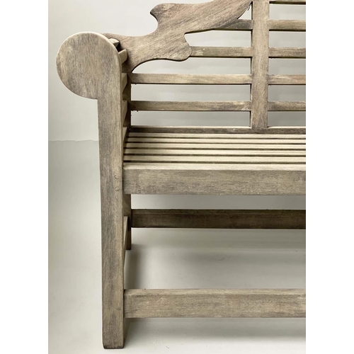 127 - LUTYENS STYLE GARDEN BENCH, silvery weathered teak of substantial slatted construction after a desig... 