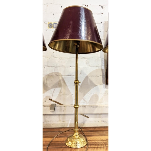 179 - TABLE LAMPS, each approx 75cm H including shades, three, adjustable, slender brass columns. (3)