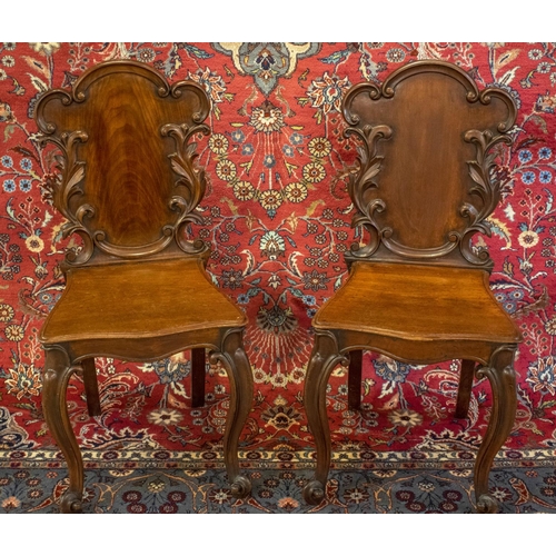 175 - HALL CHAIRS, 88cm H x 42cm, a pair, Victorian mahogany with foliate carved backs. (2)