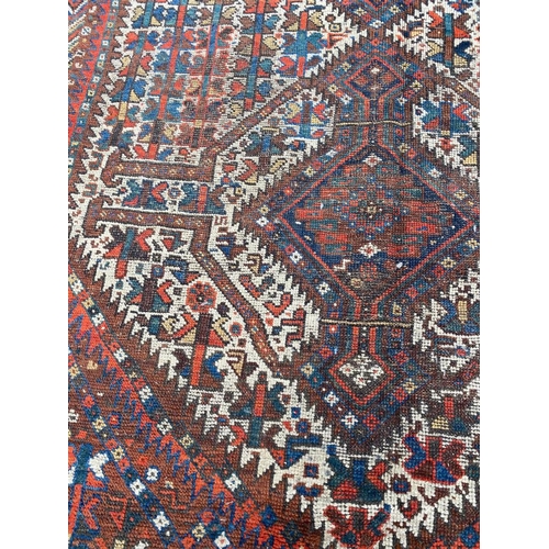 103 - ANTIQUE PERSIAN QASHQAI CARPET, 290cm x 210cm.