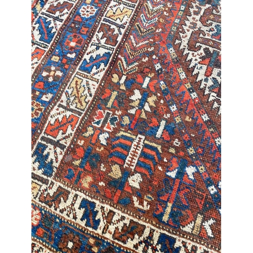 103 - ANTIQUE PERSIAN QASHQAI CARPET, 290cm x 210cm.