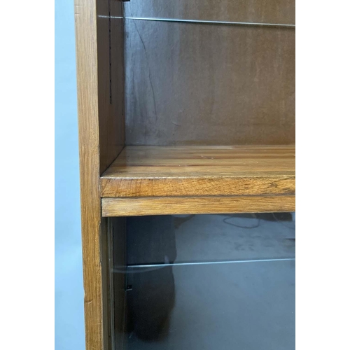 607 - HABERDASHERY DISPLAY CABINET, mid 20th century oak, with open shelved cabinet above two sliding glas... 