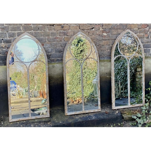 514 - ARCHITECTURAL GARDEN MIRRORS, a set of three, Gothic style aged metal frames, 122x56. (3)