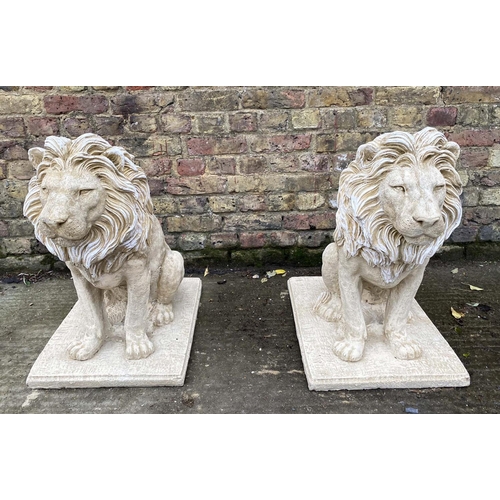 515 - SCULPTURAL LIONS, a pair, 70cm H, composite stone. (2)