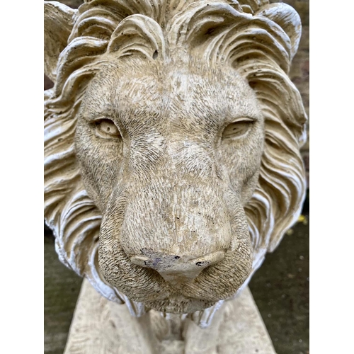 515 - SCULPTURAL LIONS, a pair, 70cm H, composite stone. (2)