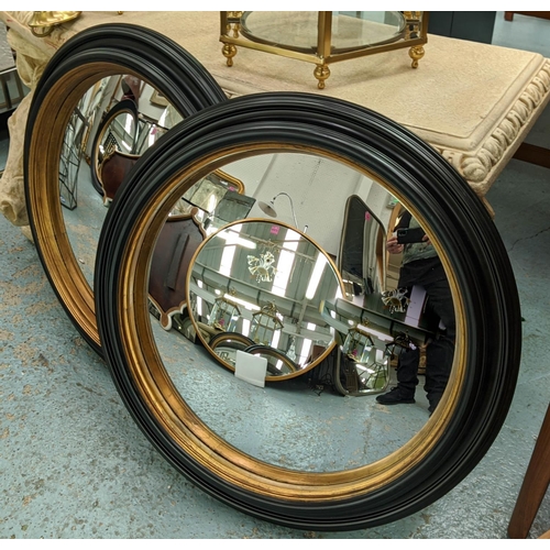 504 - CONVEX BUTLER WALL MIRRORS, a pair, 65cm diam., Regency style, black and gilt framed. (2)